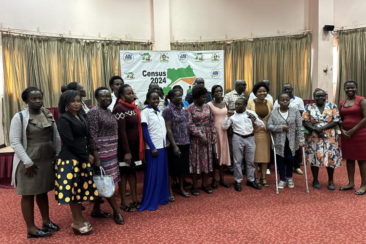 A group photo of persons with and without disabilities representing organisations of persons with disabilities and the Council at UBOS breakfast meeting